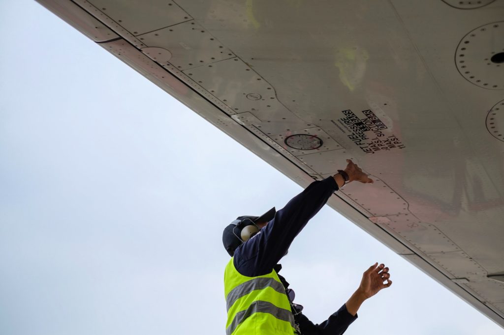 Maintenance checks being conducted on an aircraft